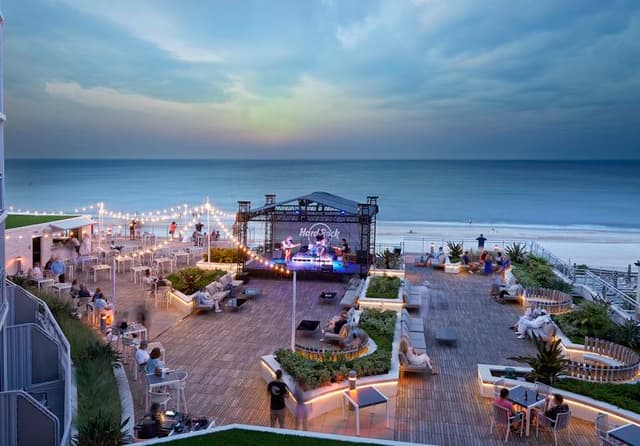 Wednesday welcome party at the Hard Rock Wave Terrace with Disasterpiece: The 2000s Rock Concert Experience